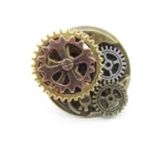 Steampunk adjustable gear ring with stacked cog design, frontal view on white background showing mixed vintage metal tones and intricate mechanical details