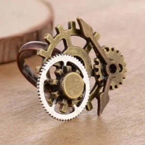 Steampunk adjustable gear ring with bronze and silver-tone interlocking gears and clock pointer detail on wooden surface