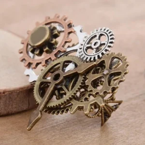 Steampunk gear ring side view showing mixed antique bronze, copper and silver metal tones with detailed gear and clock hand design on wooden surface