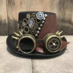Steampunk gear top hat with spiked goggles front three-quarter view, black felt with bronze gears and leather patch