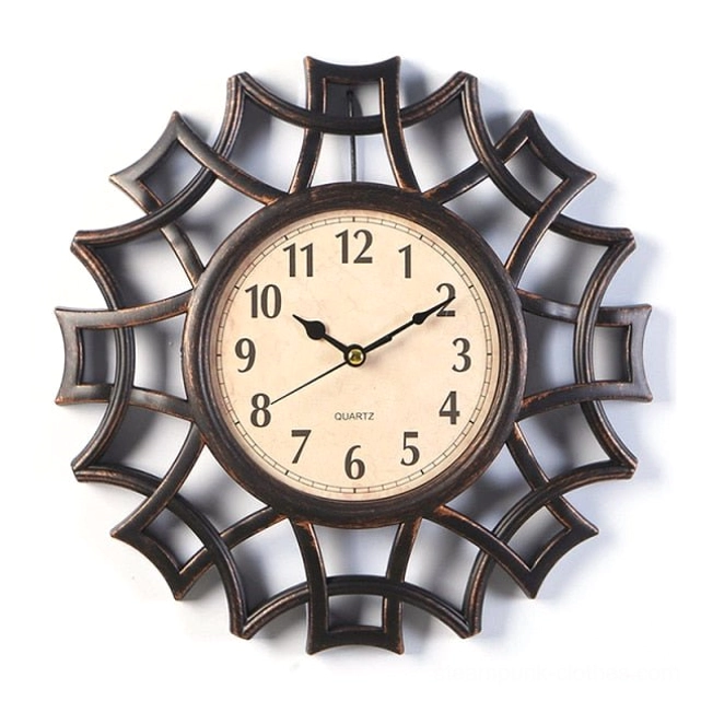 Dark brown bronze steampunk geometric wall clock front view with aged off-white dial and intricate web lattice frame design on white studio background