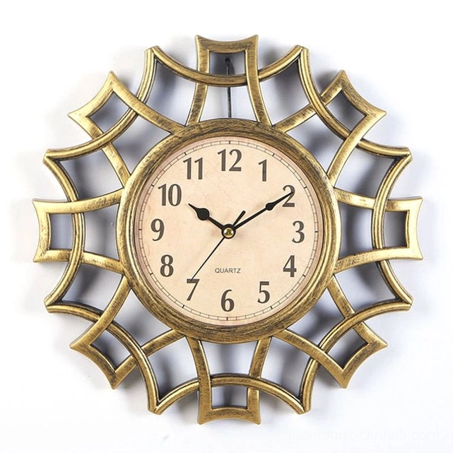 Brushed gold steampunk geometric wall clock featuring yellowed vintage dial and art deco inspired frame design studio product shot