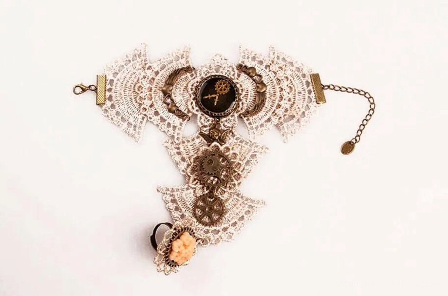 steampunk lace gloves flat lay showing adjustable chain clasp and all decorative gear components