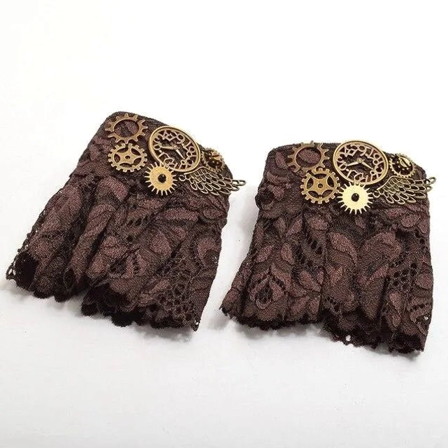 Pair of steampunk fingerless lace gloves flat lay showing dark brown lace texture, vintage brass gears, clock and wing-shaped metal decorations