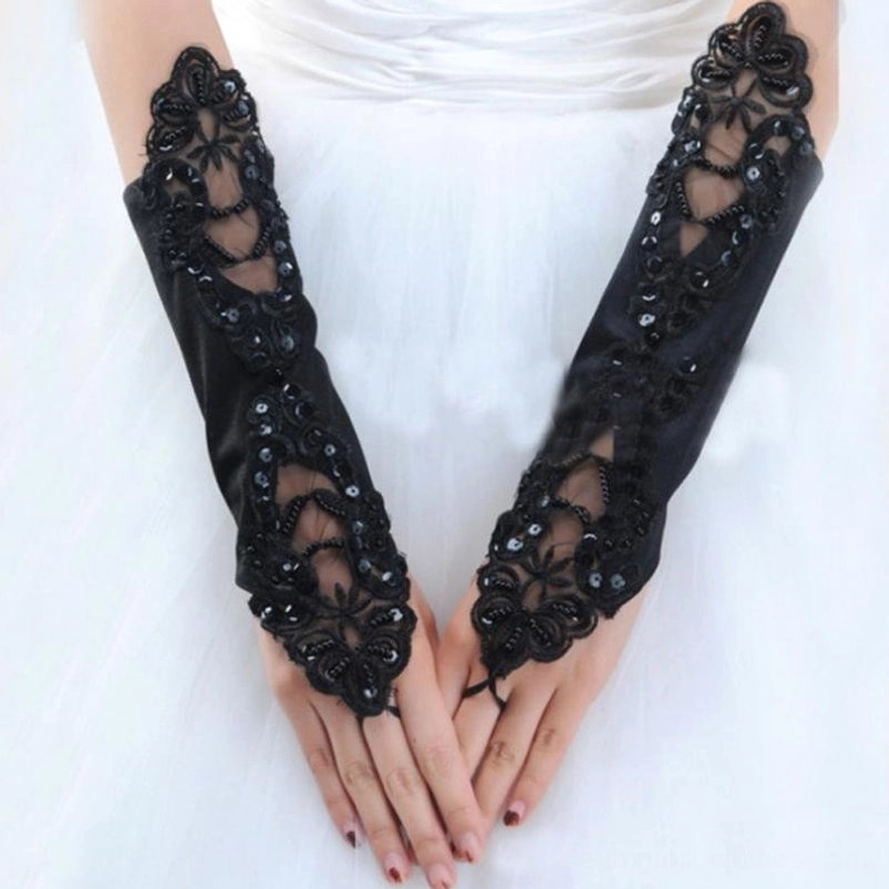 Pair of black formal steampunk gloves with dual side lace panels and sheer mesh inserts, worn on female hands against white formal dress
