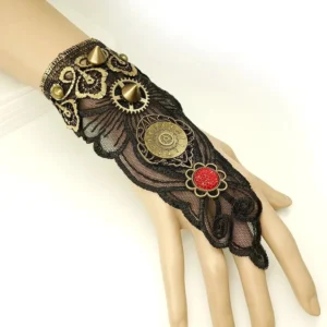 Black steampunk hand glove with bronze vintage trims and red gem accents displayed on mannequin hand, left side studio view showing lace and mechanical details