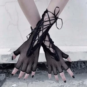Black fingerless gloves with fishnet mesh, ribbon bow lacing, and scalloped lace cuff viewed from front, showing detailed lacing system and black nail polish on female model with industrial backdrop