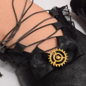 Steampunk glove wrist detail showing crisscross black leather lacing, checkered bow accent, and golden gear decoration on female model