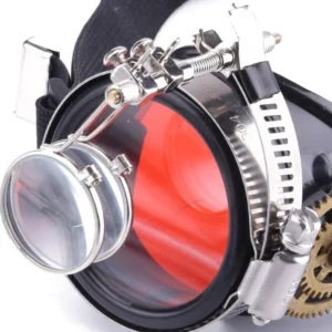 Close-up front view of steampunk monocle goggle showing red tinted lens, removable magnifying glass, and intricate silver metal hardware details