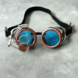 Blue steampunk goggles front view showing copper frame, colored lenses, and magnifying loupes detail