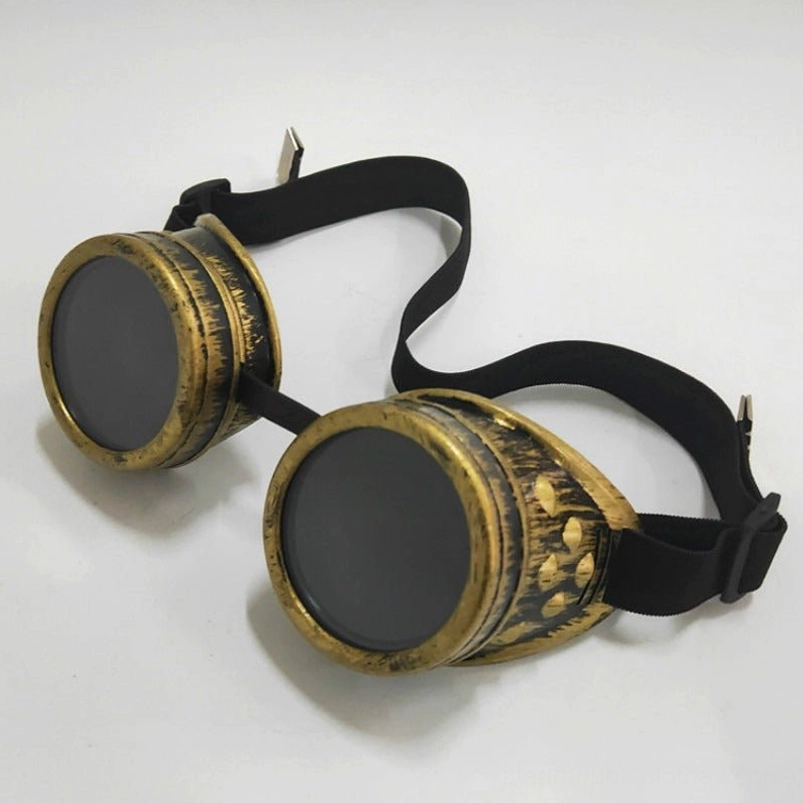 Antique bronze gold steampunk goggles with circular stud decorations, flat lay front view on white background
