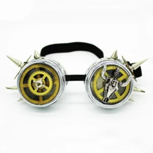 Steampunk goggles front view featuring silver metal frames, golden exposed gears, prominent bull skull decoration, metal spikes, and black elastic strap on white background