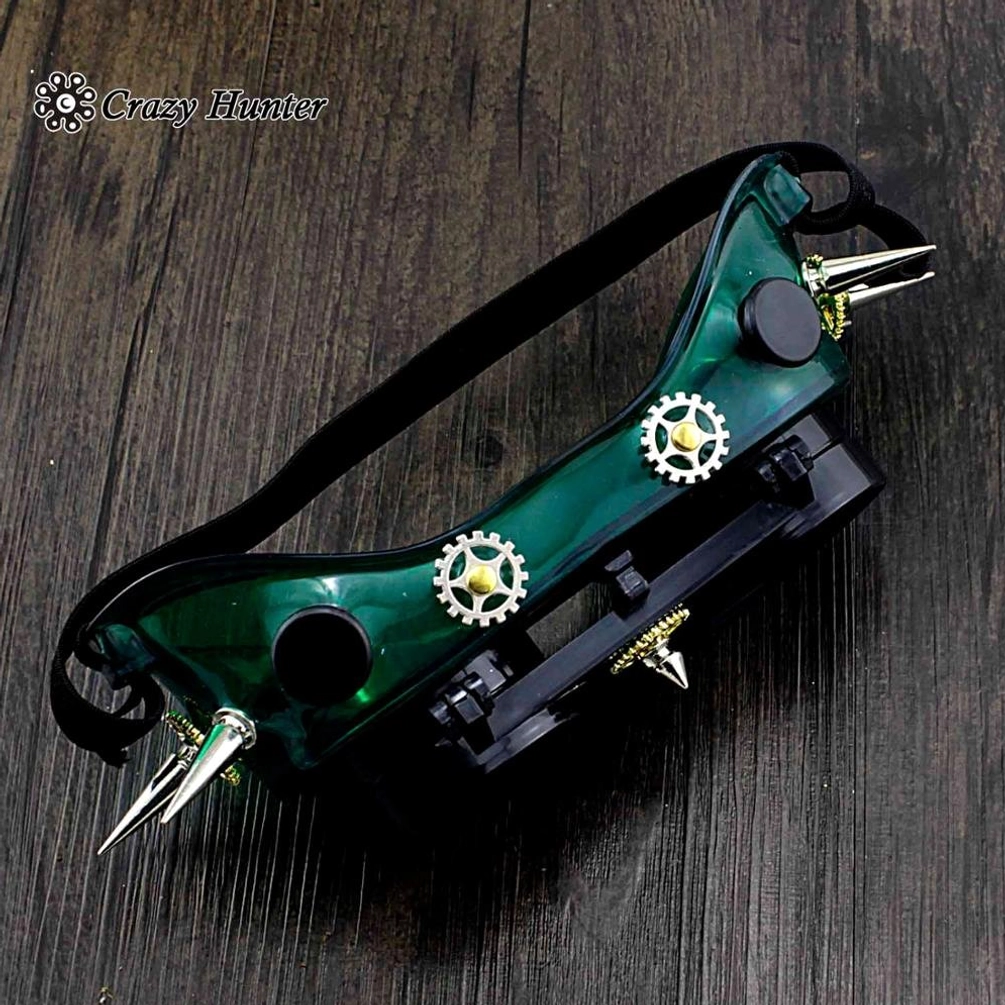 Steampunk goggles low side view highlighting green plastic frame with metal gears and silver spikes and black adjustment knobs