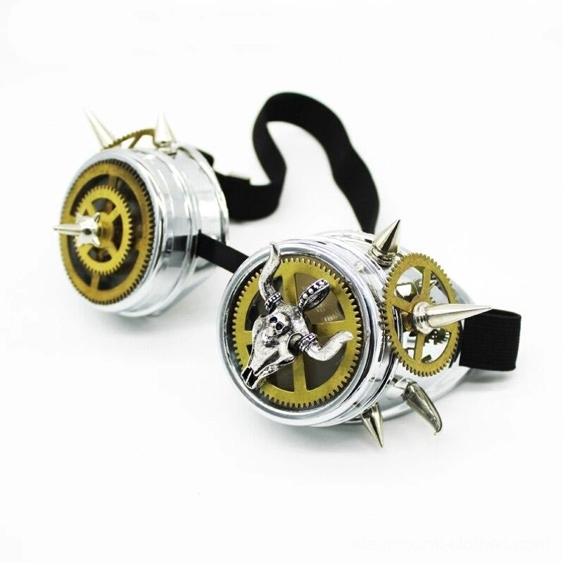 Steampunk goggles tilted perspective showing bull skull embellishment, mixed metal spike details, silver-gold color combination, and secure elastic strap