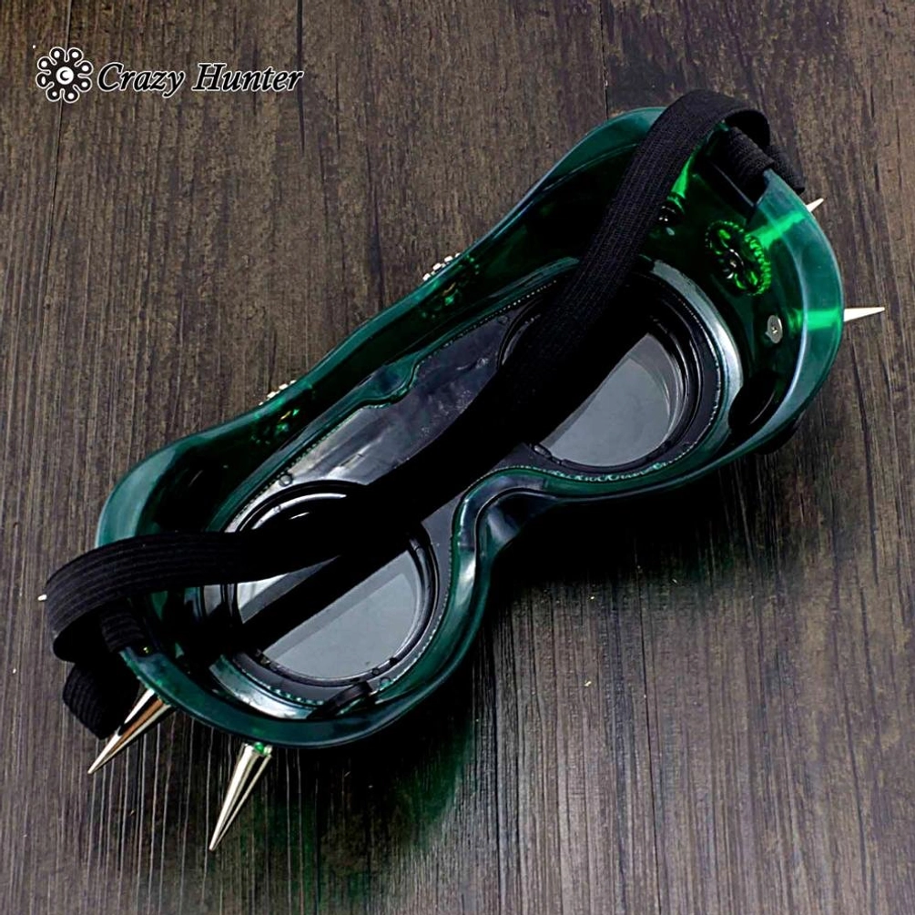 Steampunk goggles top side view showing translucent dark green frame with silver spikes and clear inner lenses detail