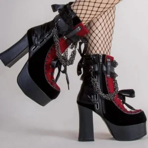 Gothic platform boots rear view showing chunky block heel and ribbon laces with fishnet stockings
