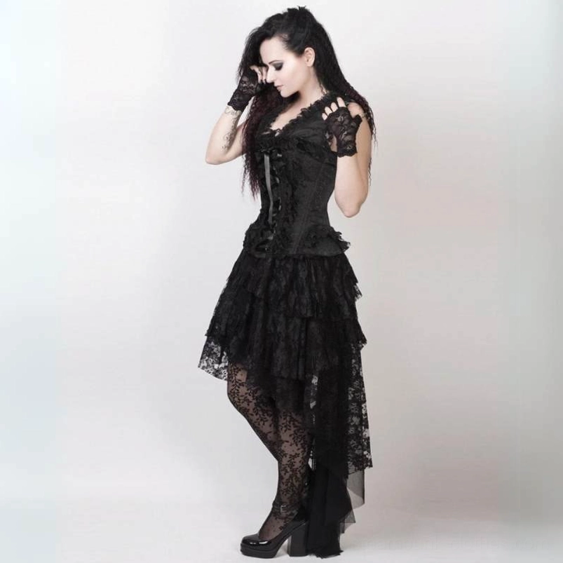 Black gothic steampunk lace cocktail dress with tiered high-low skirt, three-quarter side view showing fingerless lace gloves and fishnet stockings detail