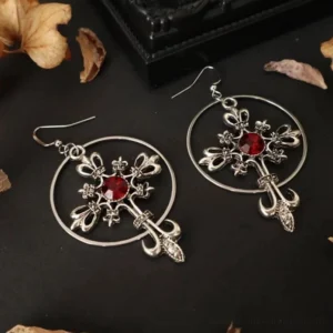 Pair of matching gothic cross hoop drop earrings with crimson gemstone cabochon centers, reversed positioning to show design symmetry, vintage silver metal finish