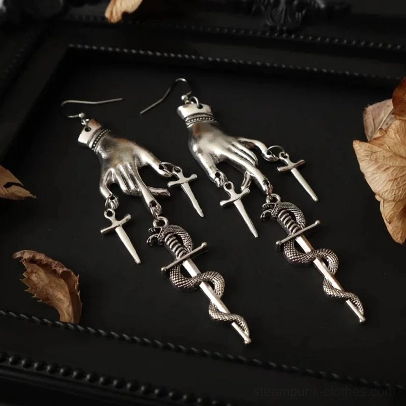 Steampunk hand and snake dagger earrings vintage silver finish paired daggers display