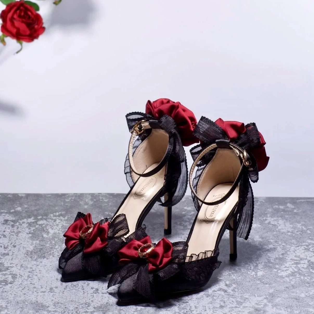 Victorian steampunk gothic lolita high heel with black lace, wine-red satin roses, and metal buckle ankle strap - three-quarter side top view showcasing lace detailing and rose embellishments