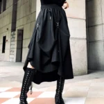 Black steampunk gothic skirt with asymmetrical hemline and metal D-ring hardware, front close-up detail view