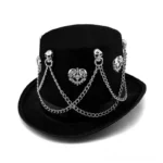 Black velvet steampunk gothic top hat with silver skull and heart ornaments, frontal view showcasing intricate crossed metal chains and decorative details