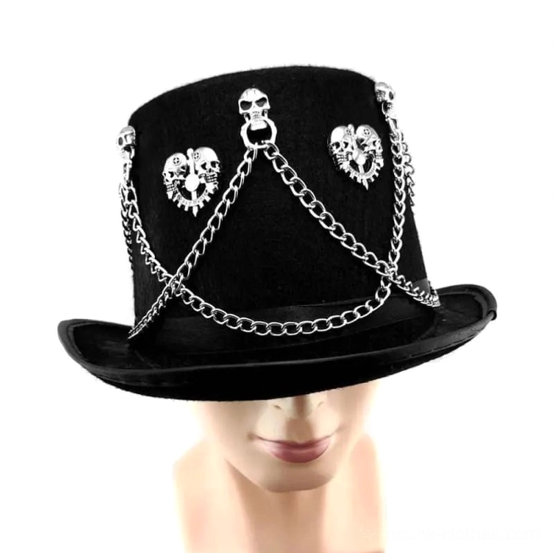Steampunk gothic top hat worn on male mannequin head, frontal close-up showing fit and silver metal decoration placement with black velvet texture