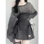 Off-shoulder lace-up steampunk grunge mini dress in washed grey, front view on model with long dark hair, featuring oversized sleeves and side corset lacing against plain wall background