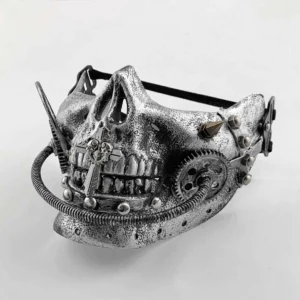 Steampunk half skull mask with aged silver faux metal texture, intricate brass gears, ornamental spikes, rivets, and decorative cross accent on the jaw, displayed on white studio background