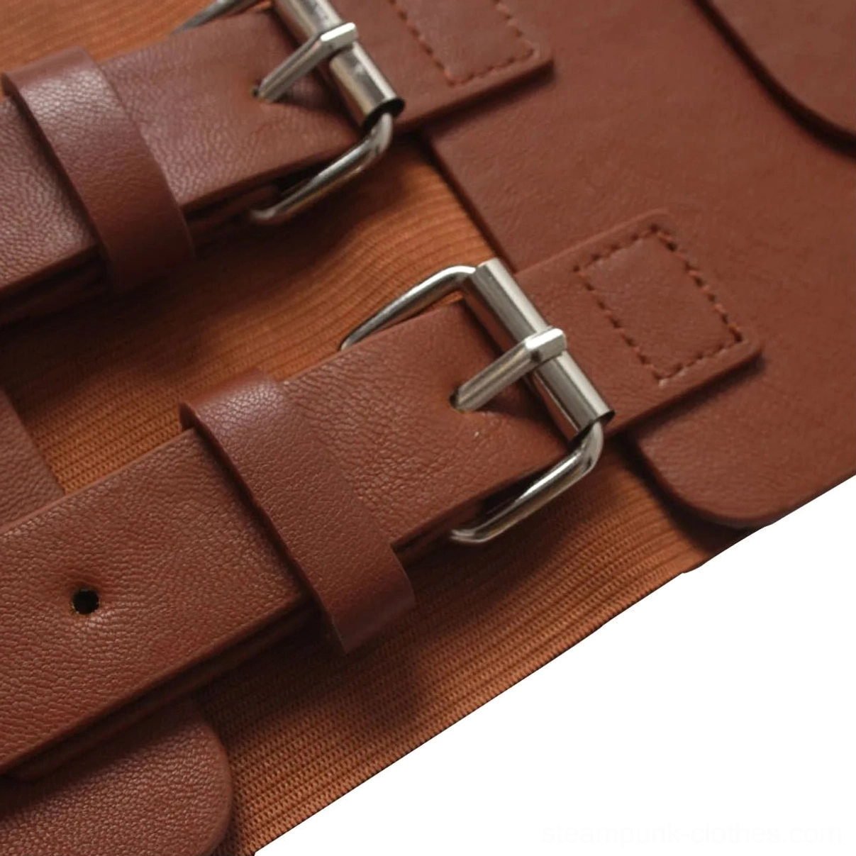 Close-up macro photography of steampunk harness belt dual metal buckles, pebbled leather surface texture, and polished silver-tone hardware craftsmanship