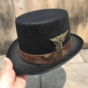 Hand holding vintage steampunk top hat featuring black felt body, brown suede band, and bronze mechanical ornaments, side perspective outdoors