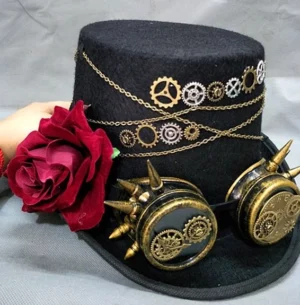 Steampunk top hat with integrated goggles and red rose detail - angled perspective highlighting brass chains and vintage mechanical embellishments