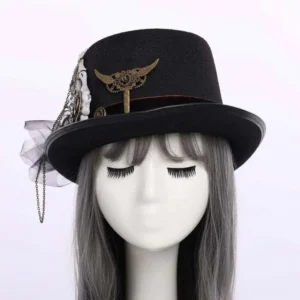 Steampunk skeleton hand hat front view on mannequin displaying brass winged key, stacked gears and side mesh veil with gothic steampunk aesthetic