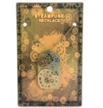 Steampunk heart clock pendant necklace with aged bronze finish and intricate gear design displayed in retail packaging