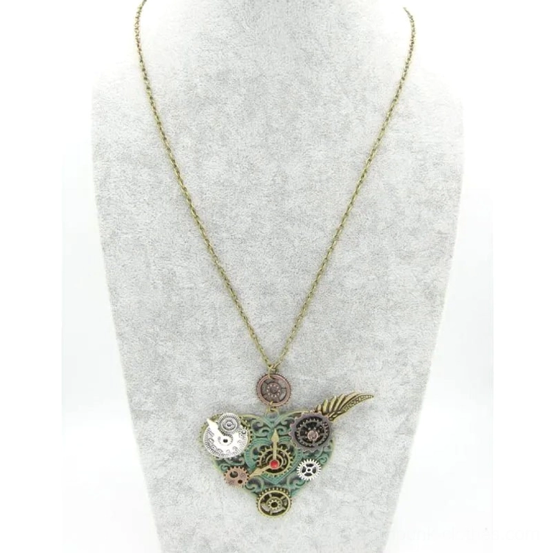 Mini steampunk heart necklace with bronze chain and classic gear motif displayed on jewelry mannequin with gray fabric display stand
