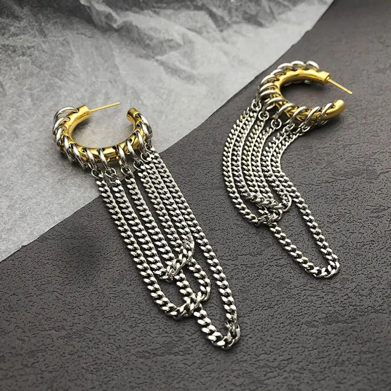 Industrial chain tassel hoop earrings with gold hoop bases and layered silver curb chain tassels, steampunk jewelry design
