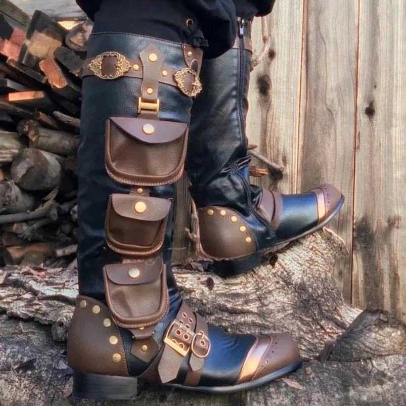 Steampunk knee-high cosplay boots with black and brown leather, metal studs, decorative buckles and utility pouches - outdoor side view showcasing industrial Victorian design details