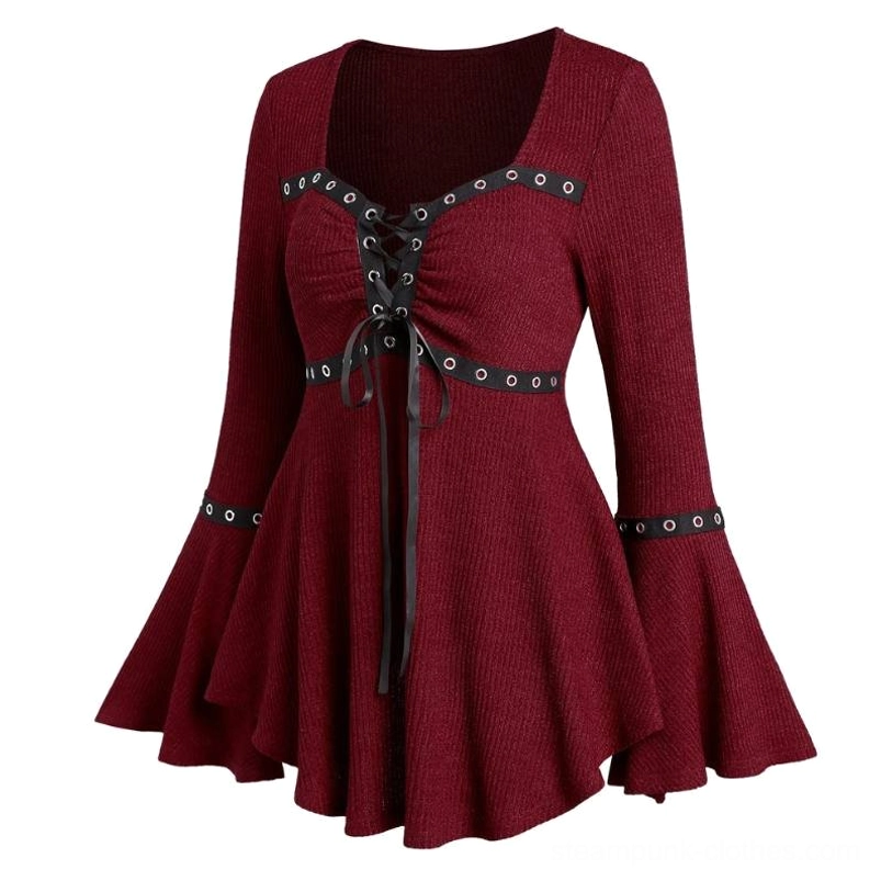 Steampunk knit top detail view showing tucked lace-up bow, flared bell sleeves with grommet cuffs, and ruched ribbed knit fabric construction