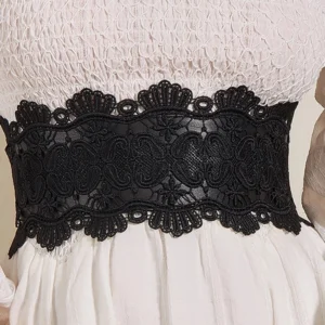 Close-up detail of steampunk lace corset belt showing intricate scalloped paisley floral lace pattern, elastic waistband, and lace-over-PU construction