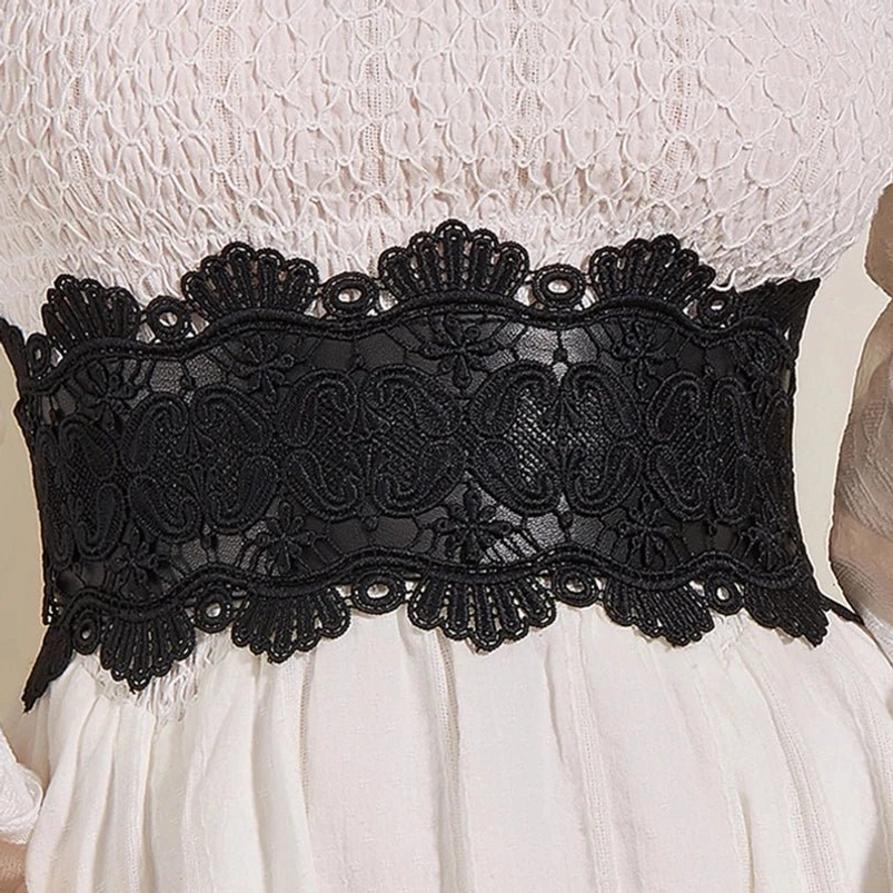 Close-up detail of steampunk lace corset belt showing intricate scalloped paisley floral lace pattern, elastic waistband, and lace-over-PU construction