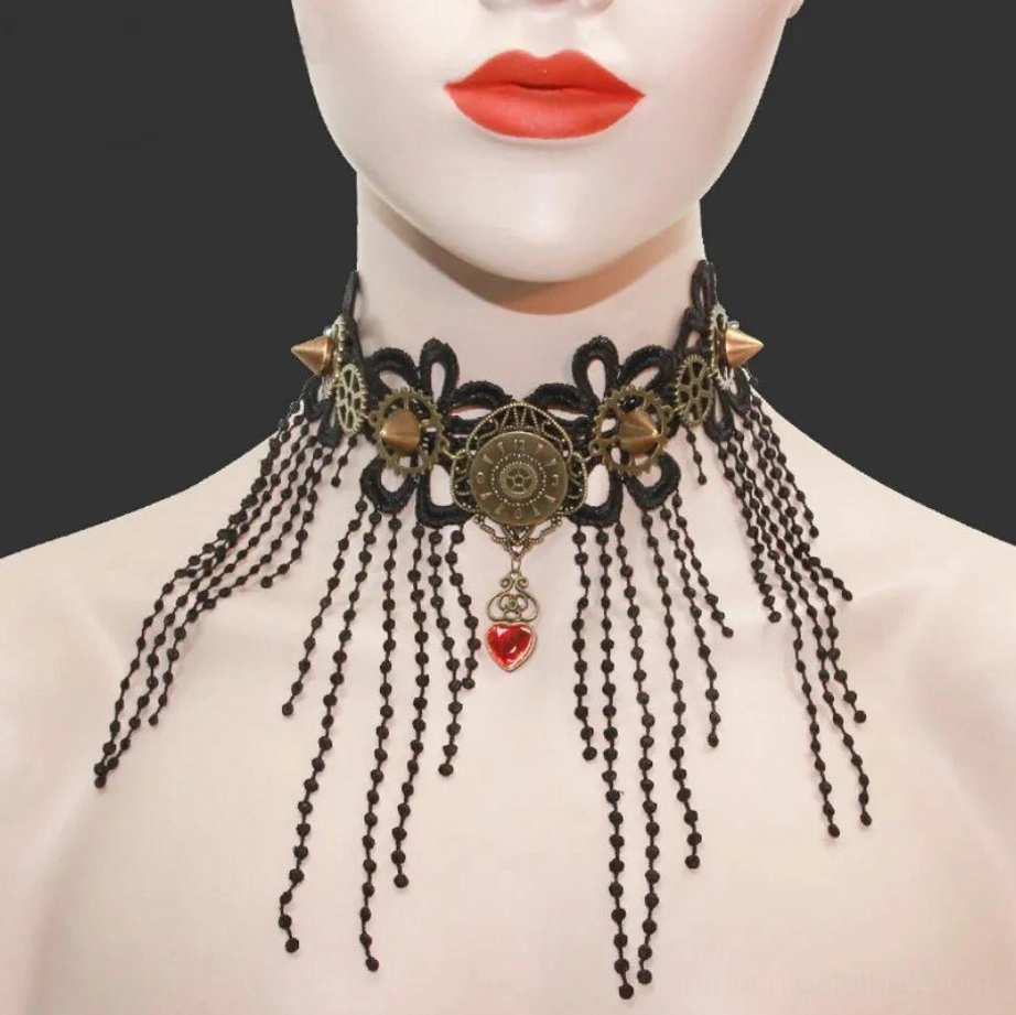 Steampunk gothic lace choker necklace front view with black floral lace, red heart pendant, bronze gears and beaded tassels on mannequin