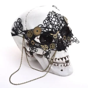 Black steampunk lace eye mask with brass gears and metal chain accents, displayed on mannequin - left 3/4 view