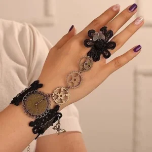 Steampunk lace hand chain gloves featuring intricate black floral lace with bronze gears, vintage clock dial, and decorative butterfly ornaments on female hand with manicure, front view