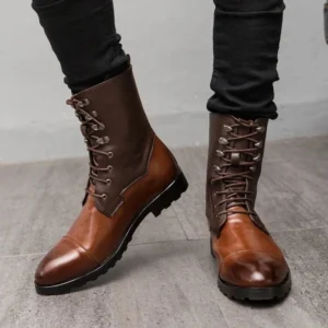 Steampunk combat boots front direct view with male model wearing black skinny jeans, highlighting polished cap toe detail, two-tone brown leather upper, industrial-grade metal eyelets, and authentic lace-up fastening system