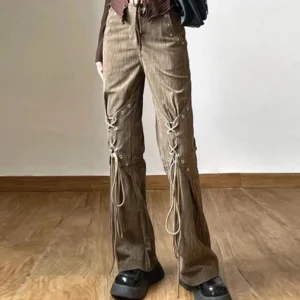 Steampunk lace-up pants full styling with black shoulder bag and platform loafers, demonstrating complete outfit coordination