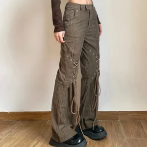 Steampunk brown corduroy lace-up flare pants front three-quarter view with metal eyelets and lace-up detailing on female model