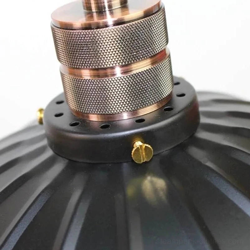 Close-up detail of bronze-toned lamp socket, knurled brass hardware and black metal mounting accents for steampunk fixture