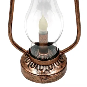 Close-up detail of steampunk lamp showing embossed bronze base and spring-mounted metal handle, direct front view