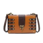 Antique brass rivet steampunk leather crossbody bag front view featuring two-tone brown vegan leather with vintage toggle clasp closure and industrial aesthetic design