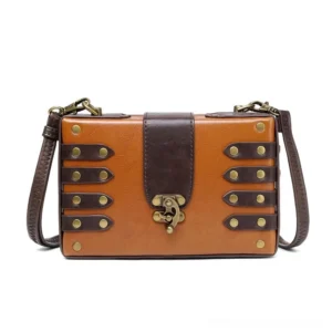 Antique brass rivet steampunk leather crossbody bag front view featuring two-tone brown vegan leather with vintage toggle clasp closure and industrial aesthetic design
